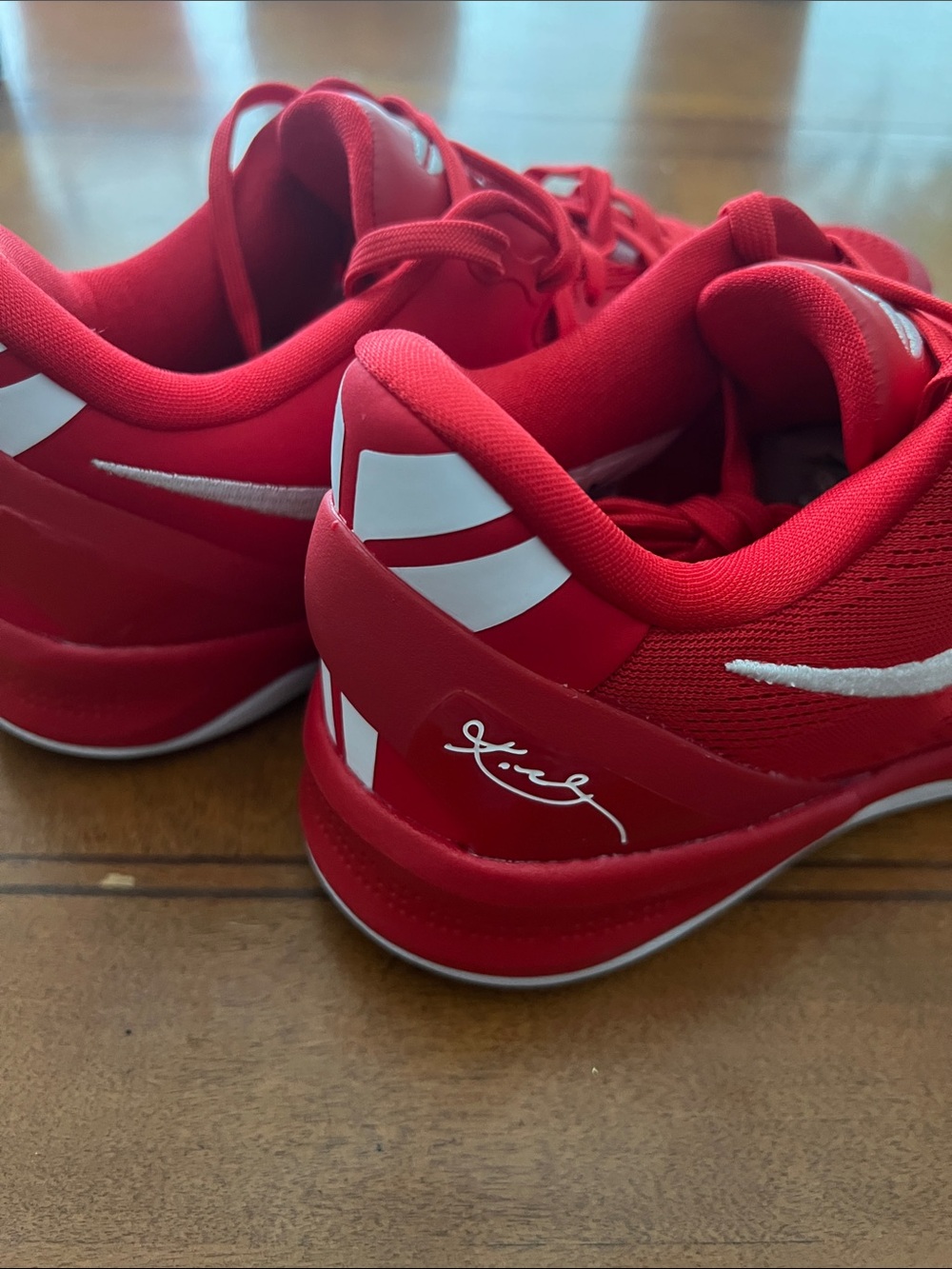 Nike Red Athletic Sneakers with White Swoosh Accents - Picture 3 of 4